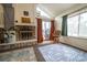 Living room with fireplace and access to backyard patio at 974 S Zeno Way, Aurora, CO 80017