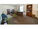 Loft area with built-in shelving and a large wooden desk at 974 S Zeno Way, Aurora, CO 80017