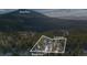 Aerial view of the property nestled among trees on a 0.79-acre lot at 439 Ronnie Rd, Golden, CO 80403