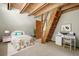 Charming bedroom with exposed wooden beams, a cozy bed, and a playful decor with a ladder to a loft at 439 Ronnie Rd, Golden, CO 80403