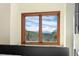 Window view with wooded vista and mountains at 439 Ronnie Rd, Golden, CO 80403