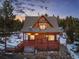 Charming cabin with a front porch and wooded scenery, perfect for peaceful mountain living at 439 Ronnie Rd, Golden, CO 80403