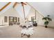 Spacious main bedroom with vaulted ceilings, scenic balcony access, and a cozy seating area at 439 Ronnie Rd, Golden, CO 80403