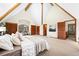 Large bedroom with wood-beamed ceiling, closet space, and natural light at 439 Ronnie Rd, Golden, CO 80403