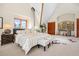 Large main bedroom features vaulted ceilings, wood beams, and a window with wooded views at 439 Ronnie Rd, Golden, CO 80403