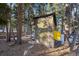 Quaint wooden outbuilding with a screened enclosure, perfect for storage or a workshop in a rustic setting at 439 Ronnie Rd, Golden, CO 80403