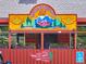Colorful restaurant exterior with mountain mural and outdoor dining at 439 Ronnie Rd, Golden, CO 80403