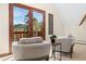 Comfortable sitting area with seating and a view of a wooded vista at 439 Ronnie Rd, Golden, CO 80403
