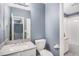 Well-lit bathroom with a neutral color scheme featuring double sinks and bath/shower combo at 5229 Nighthawk Pkwy, Brighton, CO 80601