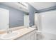 Bathroom with double sink vanity, neutral color scheme, and shower/tub combo at 5229 Nighthawk Pkwy, Brighton, CO 80601