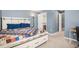 Comfortable bedroom featuring a bed with storage drawers and an open walk-in closet at 5229 Nighthawk Pkwy, Brighton, CO 80601