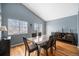 Dining area with modern table and chairs set, with a view to the backyard at 5229 Nighthawk Pkwy, Brighton, CO 80601
