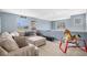 Cozy living room with comfortable seating and good natural lighting at 5229 Nighthawk Pkwy, Brighton, CO 80601