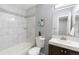Well-lit bathroom featuring marble-tiled walls, new fixtures, and a clean aesthetic at 12666 Davis St, Broomfield, CO 80020
