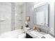 Clean bathroom featuring a shower-tub combo and granite countertop vanity at 12666 Davis St, Broomfield, CO 80020