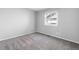 Neutral bedroom with carpeted flooring and a large window at 12666 Davis St, Broomfield, CO 80020