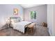 Bright bedroom featuring a large window, neutral paint and carpet at 12666 Davis St, Broomfield, CO 80020