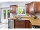 Updated kitchen featuring granite countertops, stainless steel appliances, and a stylish backsplash at 12666 Davis St, Broomfield, CO 80020