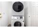 Convenient laundry area featuring a stacked washer and dryer at 12666 Davis St, Broomfield, CO 80020
