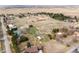 Aerial view showcases a neighborhood boasting expansive properties and mature trees at 12579 Appaloosa Pl, Broomfield, CO 80020