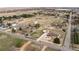 A beautiful aerial view of a neighborhood featuring sprawling, fenced yards and mature trees at 12579 Appaloosa Pl, Broomfield, CO 80020