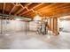 Unfinished basement featuring concrete flooring, block walls, exposed ceiling beams, and mechanical equipment at 12579 Appaloosa Pl, Broomfield, CO 80020