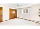 Bedroom featuring a large double-door closet, neutral carpet, a window and overhead lighting at 12579 Appaloosa Pl, Broomfield, CO 80020