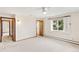 Bright bedroom featuring neutral carpet, a ceiling fan, and multiple doorways at 12579 Appaloosa Pl, Broomfield, CO 80020