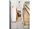 Inviting entryway features tiled floors and a staircase, offering a glimpse into the home's layout at 12579 Appaloosa Pl, Broomfield, CO 80020