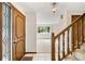 Inviting entryway features tiled floors and a staircase, offering a glimpse into the home's layout at 12579 Appaloosa Pl, Broomfield, CO 80020
