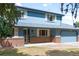 Charming two-story home boasts a welcoming entrance and an attached two-car garage at 12579 Appaloosa Pl, Broomfield, CO 80020