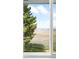 Lovely view of the surrounding landscape and backyard, seen through a bright, white-trimmed window at 12579 Appaloosa Pl, Broomfield, CO 80020