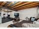 Unfinished basement area showing exposed ceiling, white walls, and designated workout space with exercise equipment at 4785 Aberdeen Ave, Highlands Ranch, CO 80126