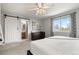 This primary bedroom features a sliding barn door to the en-suite bath at 4785 Aberdeen Ave, Highlands Ranch, CO 80126