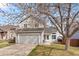Charming two-story home featuring a two-car garage, landscaped yard, and inviting front porch at 4785 Aberdeen Ave, Highlands Ranch, CO 80126