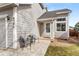 Inviting covered front porch with seating, stylish details, and great curb appeal at 4785 Aberdeen Ave, Highlands Ranch, CO 80126