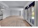 Finished basement with wood-look flooring, and access to the backyard at 5668 S Rifle Ct, Centennial, CO 80015