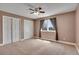 Bedroom featuring carpeted floor, standard closet doors, and lots of light at 5668 S Rifle Ct, Centennial, CO 80015