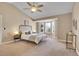 Charming bedroom featuring a bay window, neutral color palette and ceiling fan at 5668 S Rifle Ct, Centennial, CO 80015