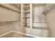 Walk-in closet with shelving and hanging rods at 5668 S Rifle Ct, Centennial, CO 80015