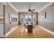 Inviting dining room with wood floors, stylish seating, and a bay window offering natural light at 5668 S Rifle Ct, Centennial, CO 80015