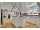 Bright kitchen with stone floors, a center island, and an open design at 5668 S Rifle Ct, Centennial, CO 80015