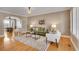 Cozy living room featuring a modern rug, comfortable seating, and an arched entryway at 5668 S Rifle Ct, Centennial, CO 80015