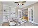 Office space with built-in shelves, modern desk, and staircase views at 5668 S Rifle Ct, Centennial, CO 80015
