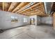 Unfinished basement space with exposed ceiling, concrete floor, and window views, ready for customization at 8109 Mount Ouray Rd, Littleton, CO 80125