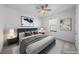 Stylishly furnished bedroom with a comfortable bed, modern art, and soft lighting, creating a relaxing space at 8109 Mount Ouray Rd, Littleton, CO 80125