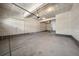Spacious unfinished garage with concrete floor and drywall walls, perfect for parking and storage at 8109 Mount Ouray Rd, Littleton, CO 80125