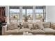 Bright living room featuring a large sofa, decorative pillows and a stunning view at 8109 Mount Ouray Rd, Littleton, CO 80125