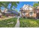 Backyard featuring lush grass, a patio dining set and a brick home exterior offering a serene outdoor retreat at 1006 S Emerson St, Denver, CO 80209