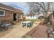 Outdoor patio and landscaped yard with table and seating at 1006 S Emerson St, Denver, CO 80209